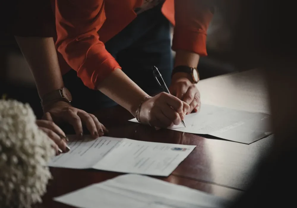 People signing contract